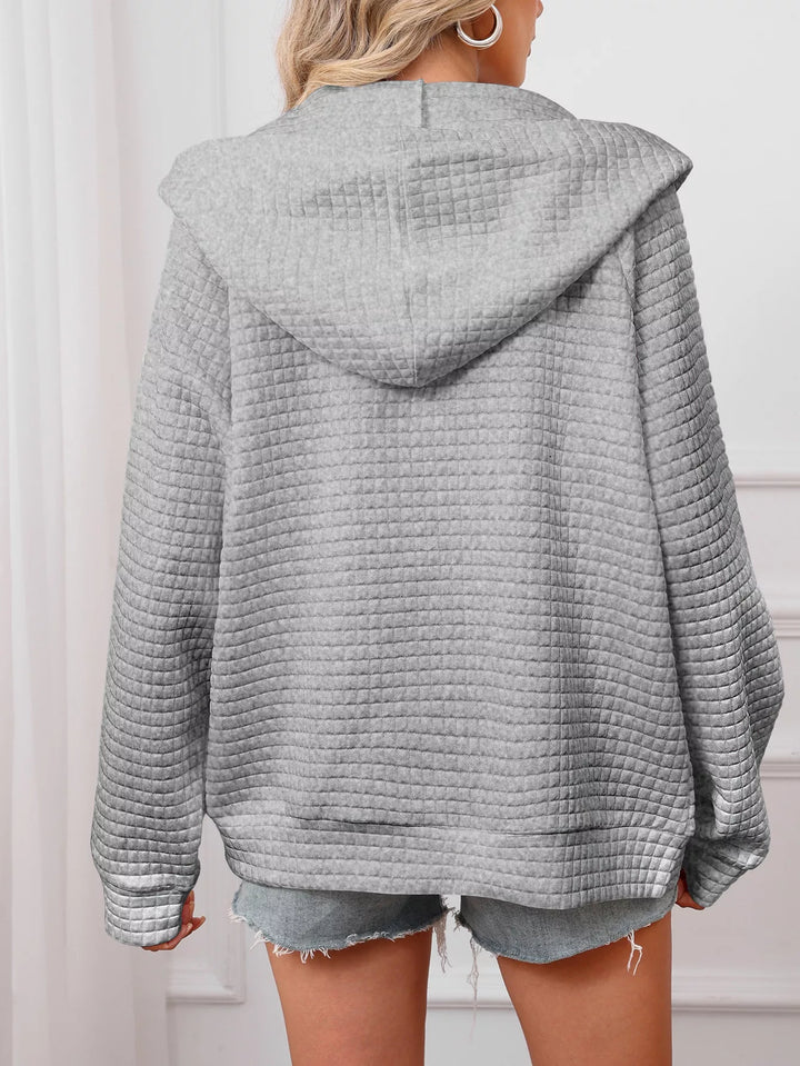 Textured quilted zip-up hooded jacket with pockets