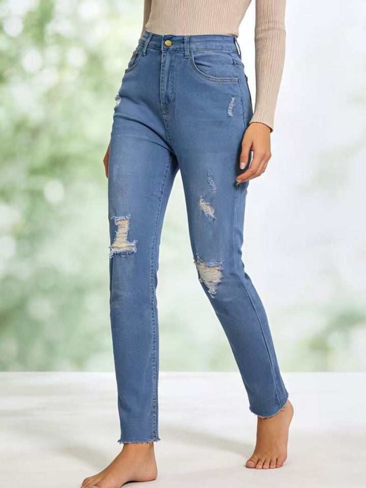 Distressed high-rise skinny jeans with frayed hem
