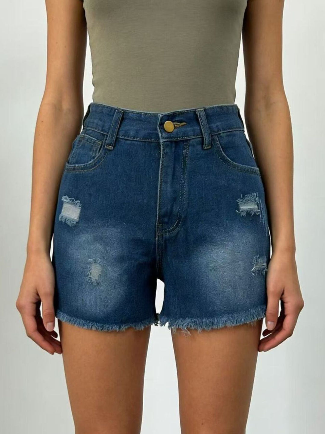 Distressed high-rise denim shorts with frayed raw hem