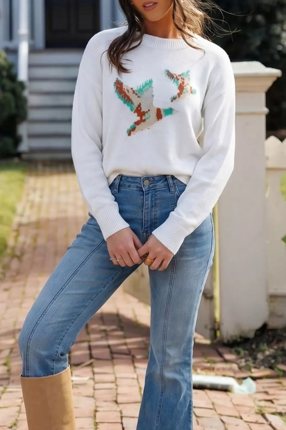 Drop shoulder crew neck sweater with knit bird graphic