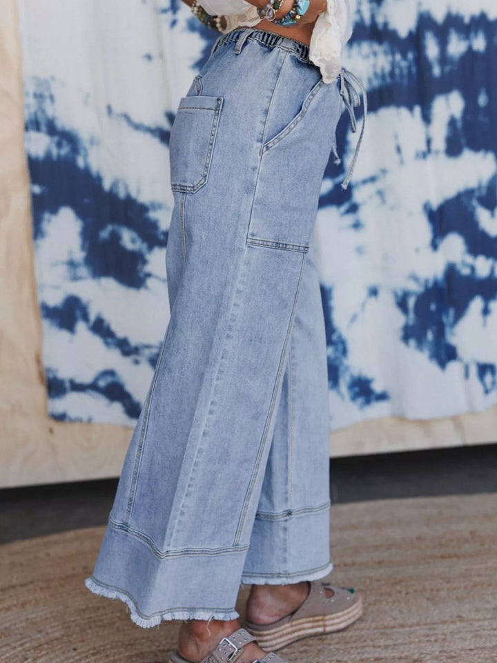 Wide-leg drawstring jeans with raw frayed hem
