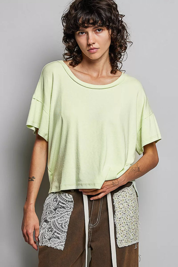 Relaxed short sleeve tee with high-low hem and exposed seams