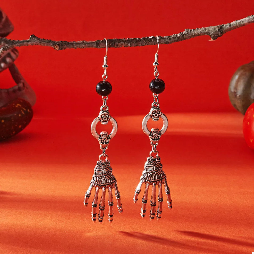 Skeleton hand drop earrings with skull charms