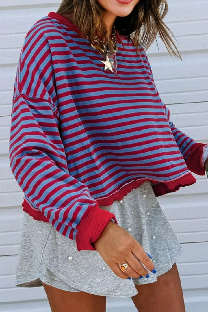 Striped exposed-seam oversized sweatshirt with contrast trim