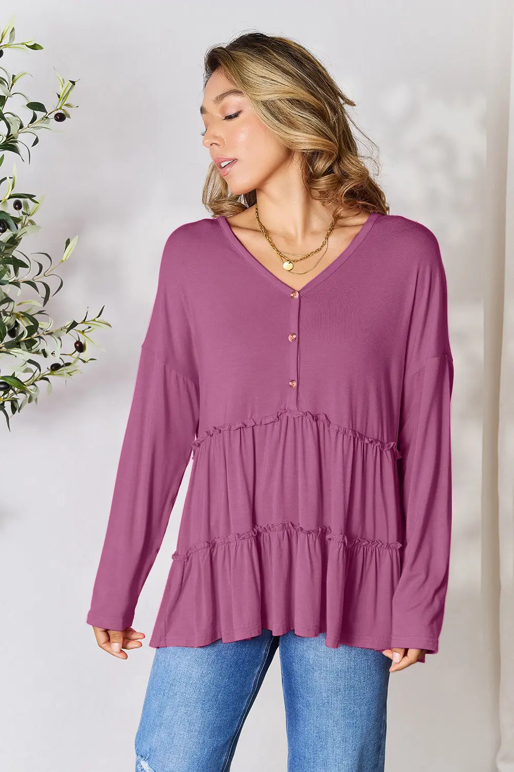 Half-button long sleeve blouse with tiered ruffle hem