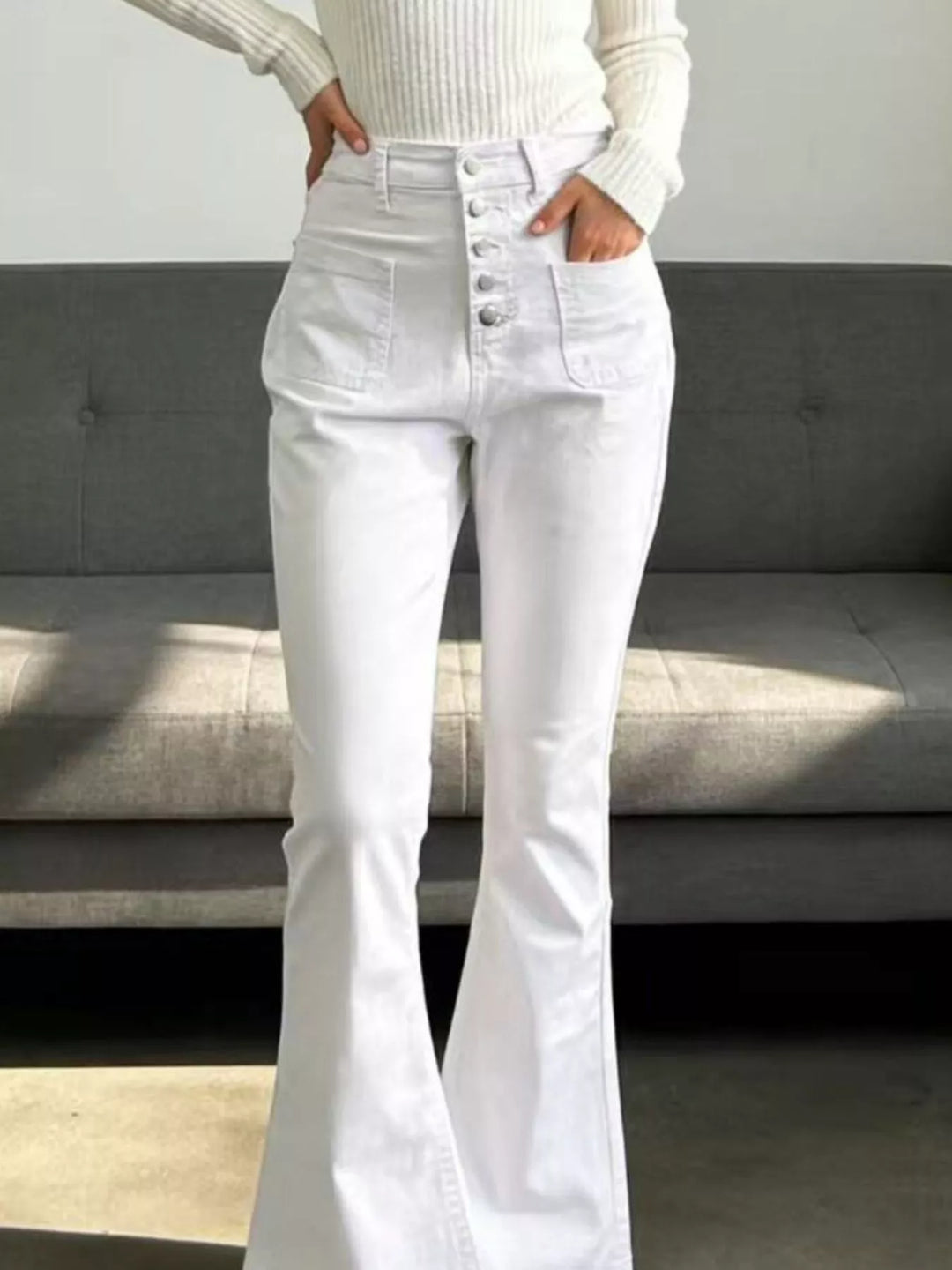 High-waisted button-fly flare jeans with patch pockets