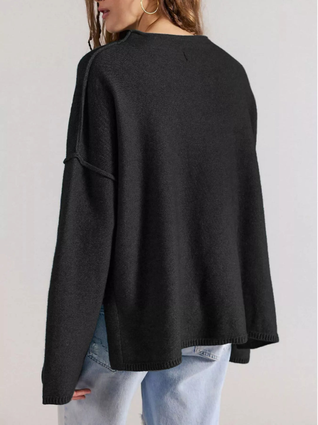 Exposed seam oversized knit sweater with wide sleeves