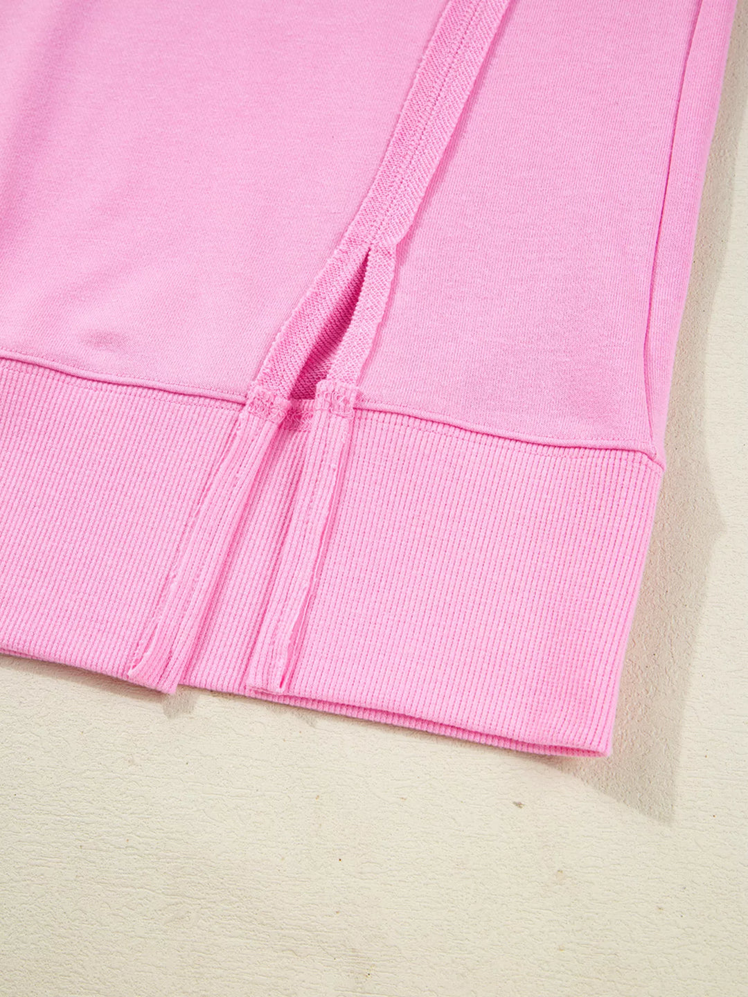 Oversized XOXO graphic sweatshirt with exposed seams and bows