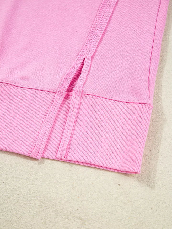 Oversized XOXO graphic sweatshirt with exposed seams and bows