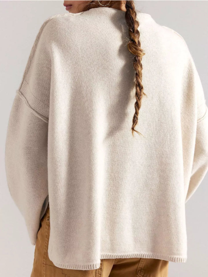 Exposed seam oversized knit sweater with wide sleeves