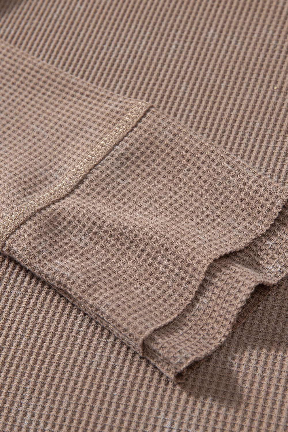 Waffle knit henley top with long sleeves and button placket