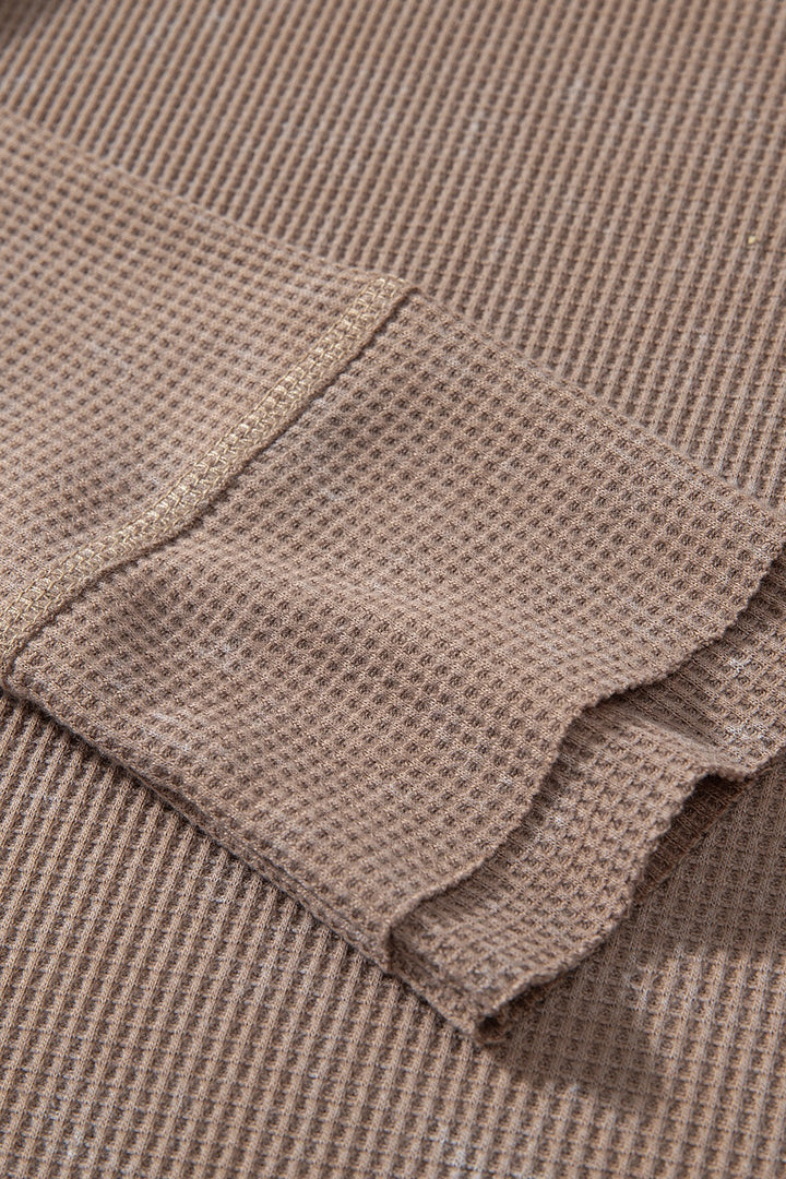Waffle knit henley top with long sleeves and button placket
