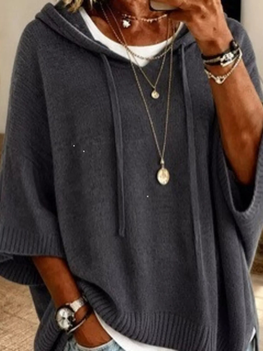Oversized hooded sweater with drawstring and ribbed trim