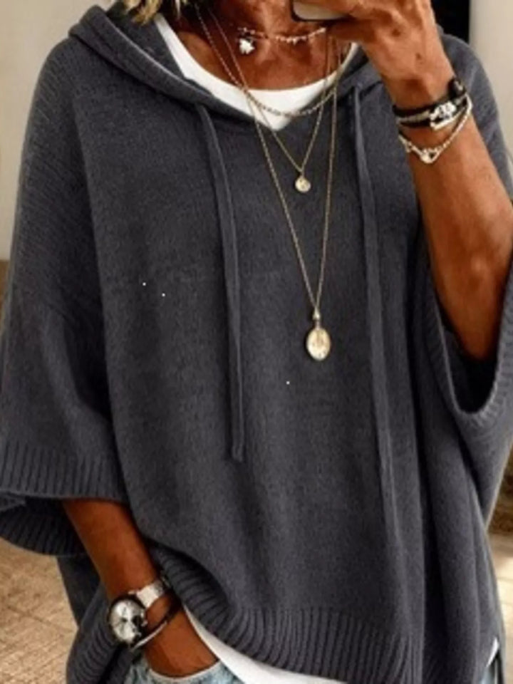 Oversized hooded sweater with drawstring and ribbed trim