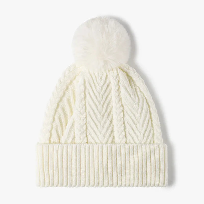 Cream Cable knit beanie with faux fur pompom and ribbed cuff