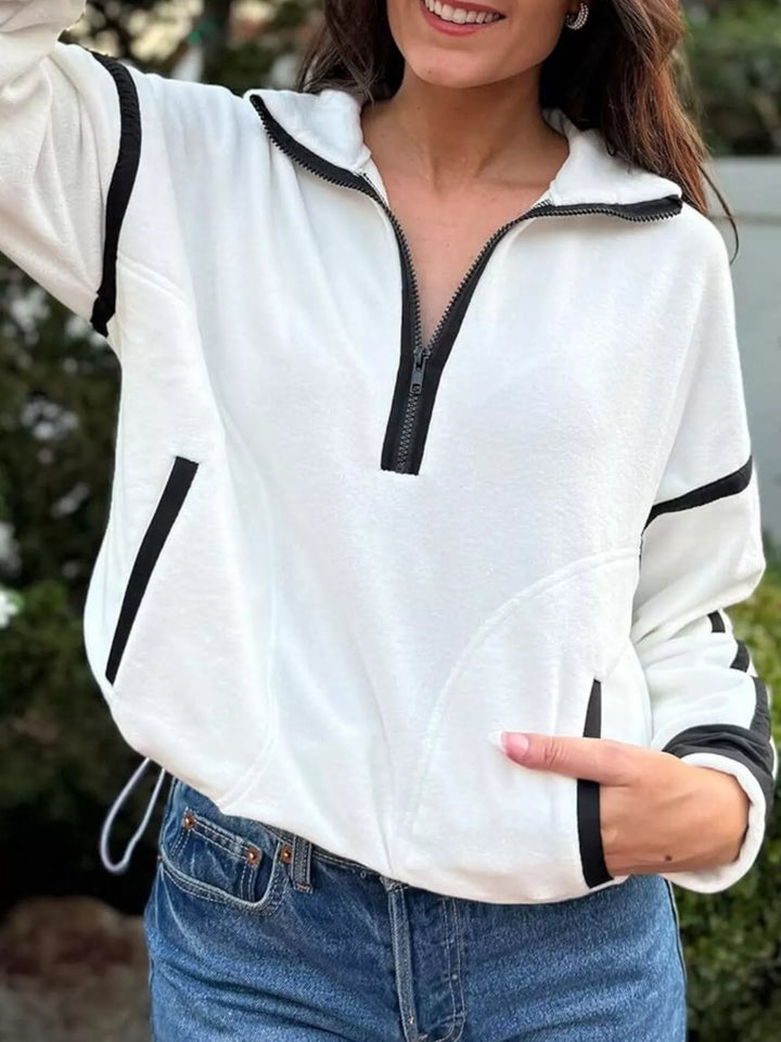 Half-zip fleece pullover with contrast trim and zip pockets