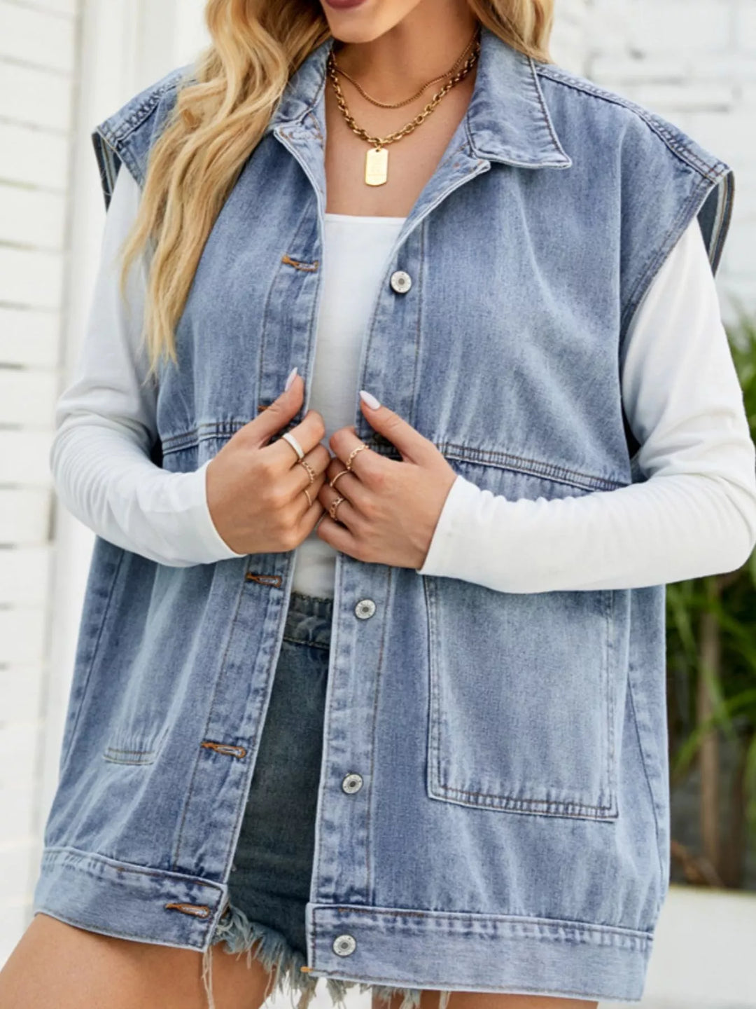 Sleeveless button-down denim vest jacket with patch pockets