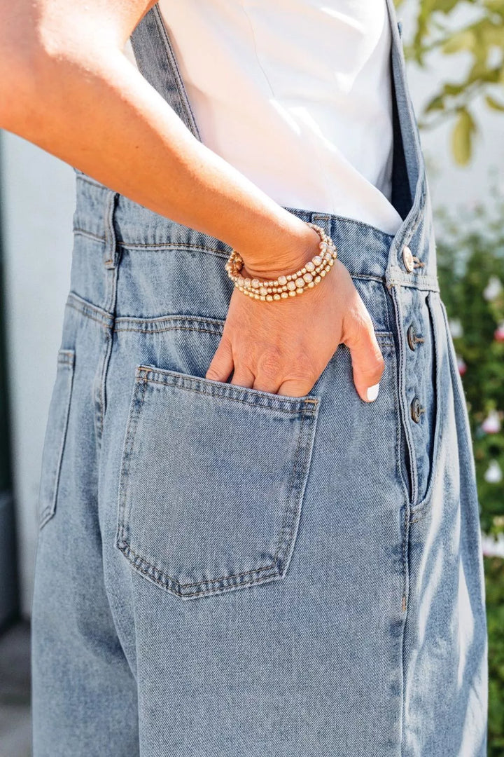 Pleated wide-leg denim overall jumpsuit with bib pocket