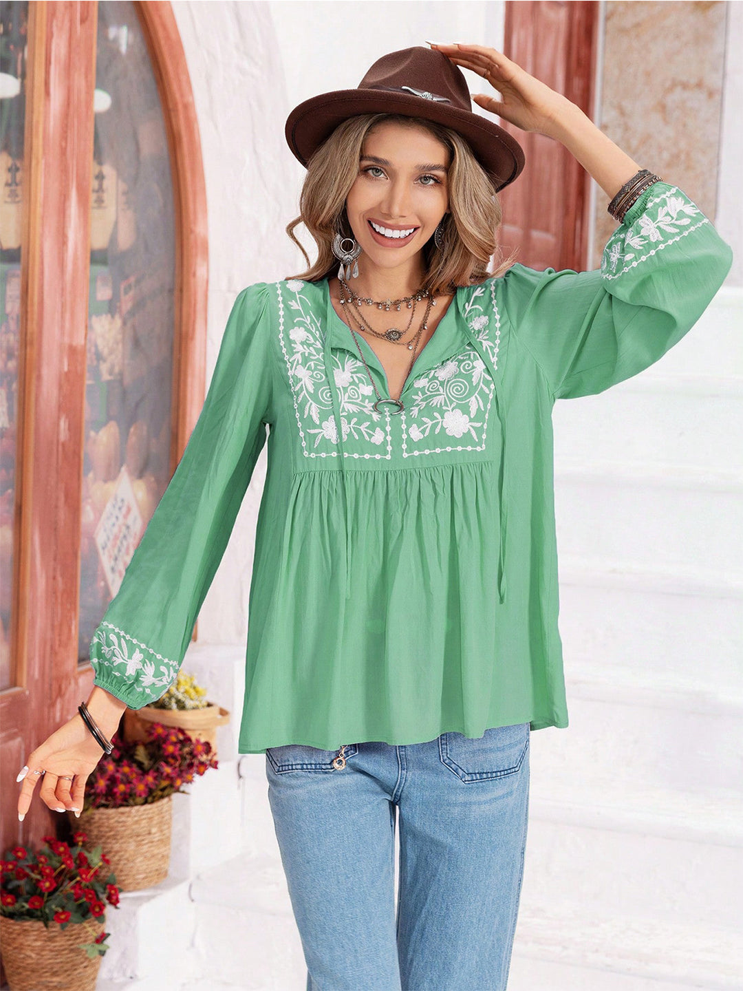 Floral embroidered tie-neck balloon sleeve blouse
