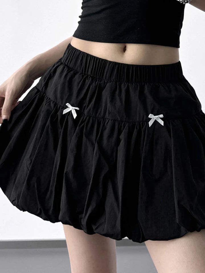 Bubble hem mini skirt with bow trim and elastic waist