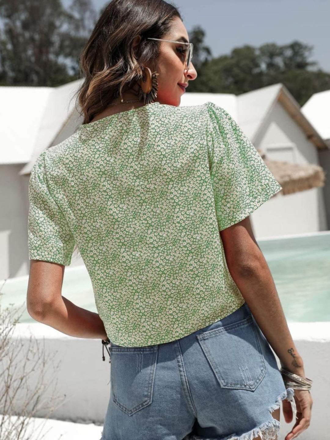 Floral drawstring crop top with deep V-neck and flutter sleeves