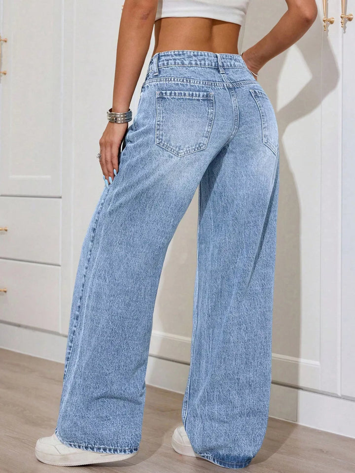 Low-rise washed wide leg jeans with faded whiskering