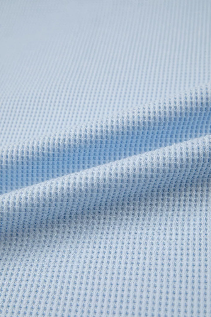 Waffle knit pocket tee with cuffed short sleeves