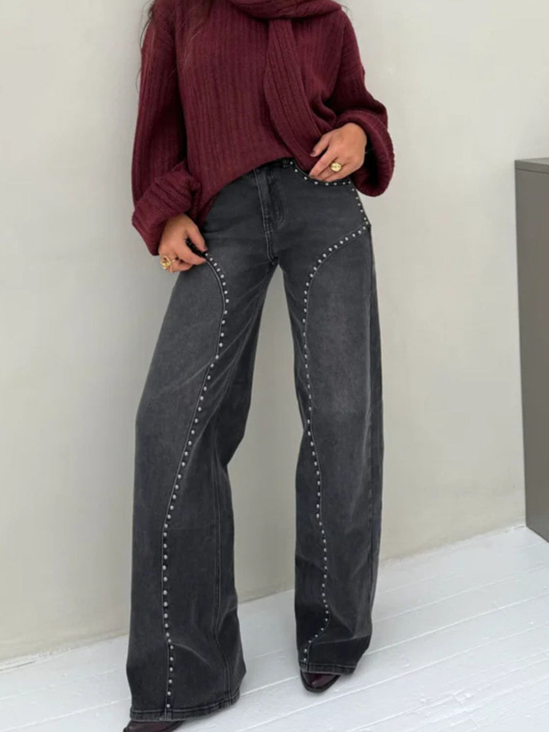 Studded high-rise wide-leg jeans with curved seam detail