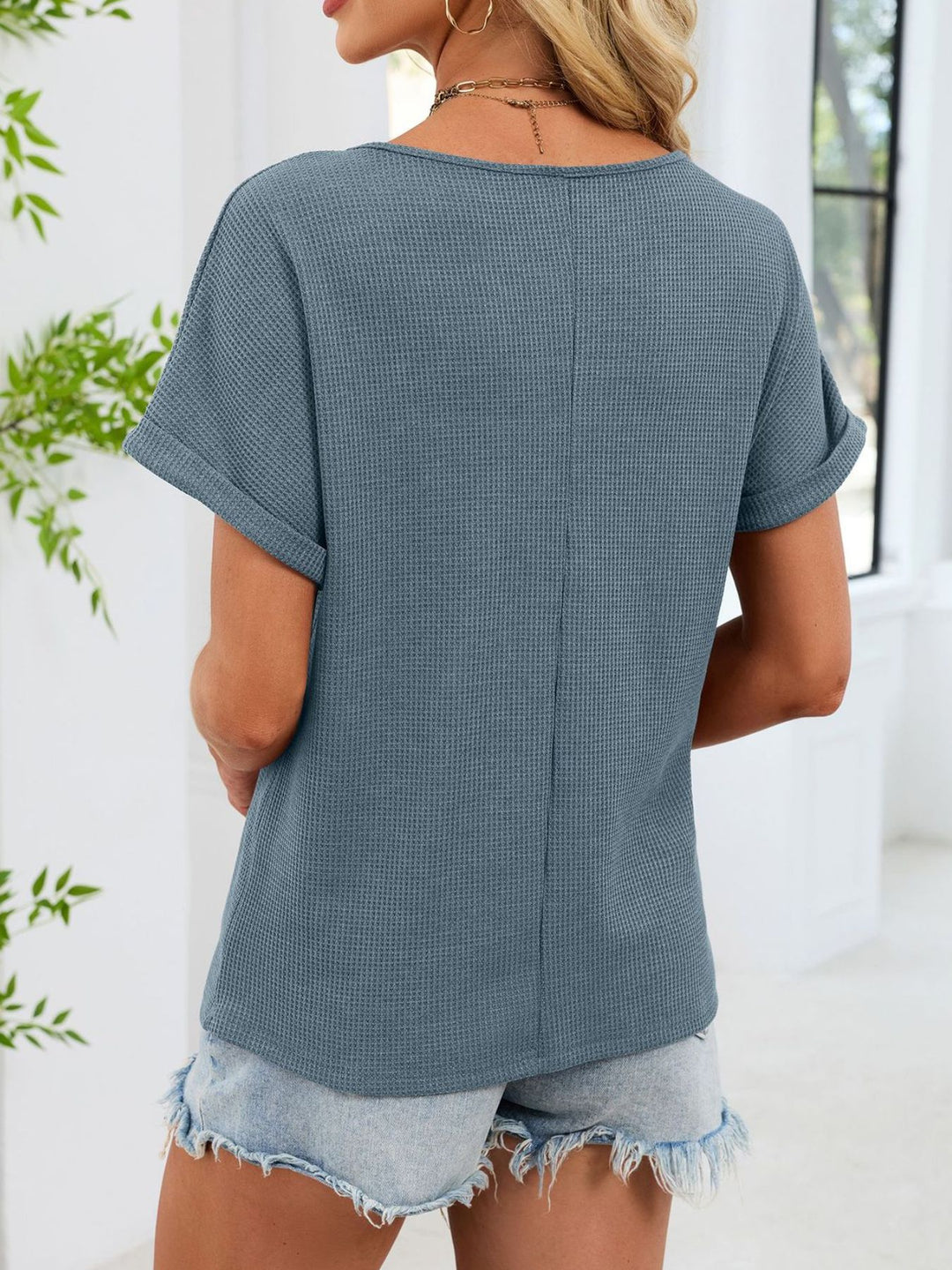 Waffle knit top with lace inset yoke and cuffed sleeves