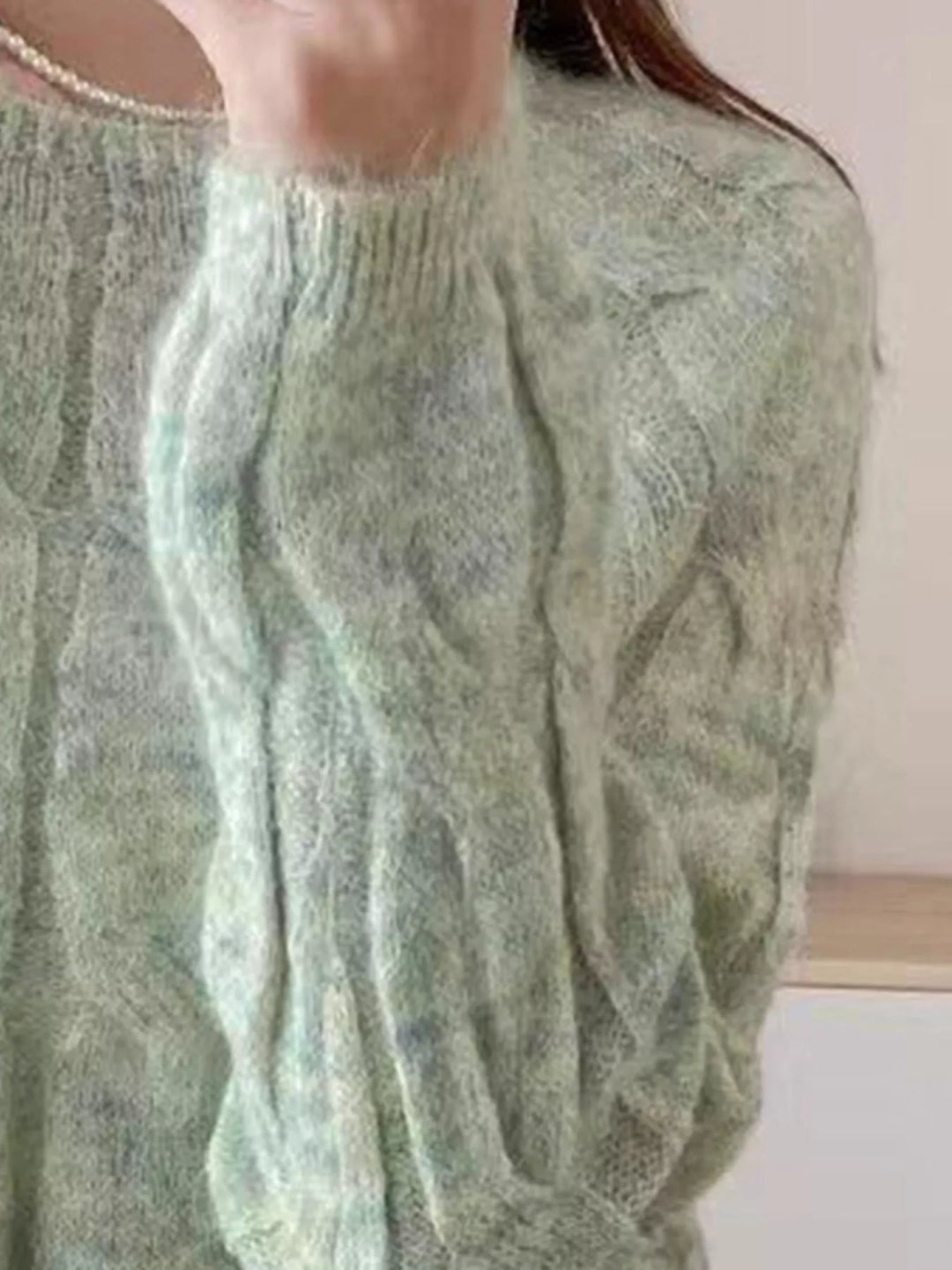 Cable-knit round neck pullover with ribbed cuffs and hem