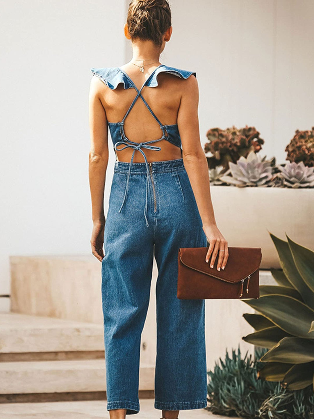 Ruffled sleeveless wide-leg denim jumpsuit