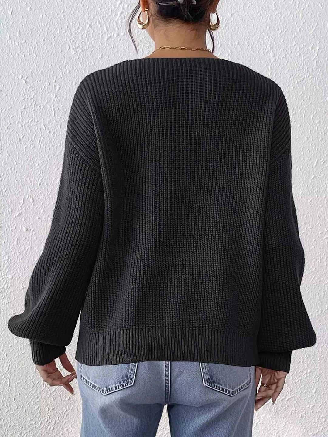 Ribbed knit V-neck sweater with bow-tie sleeves