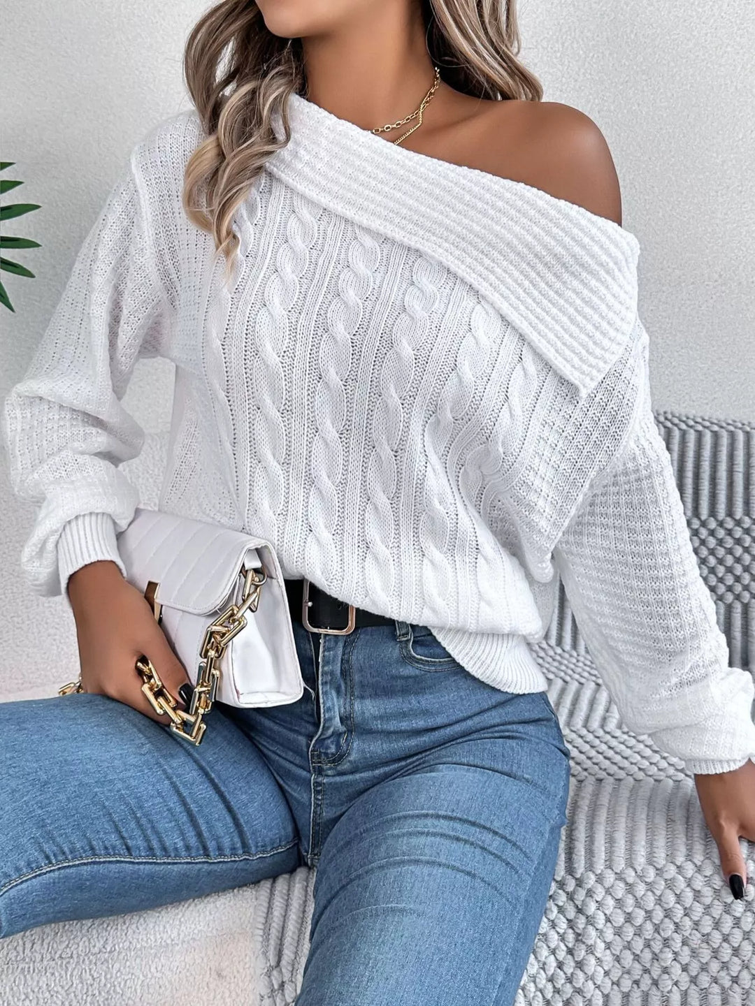 Cable knit one-shoulder sweater with fold-over ribbed collar
