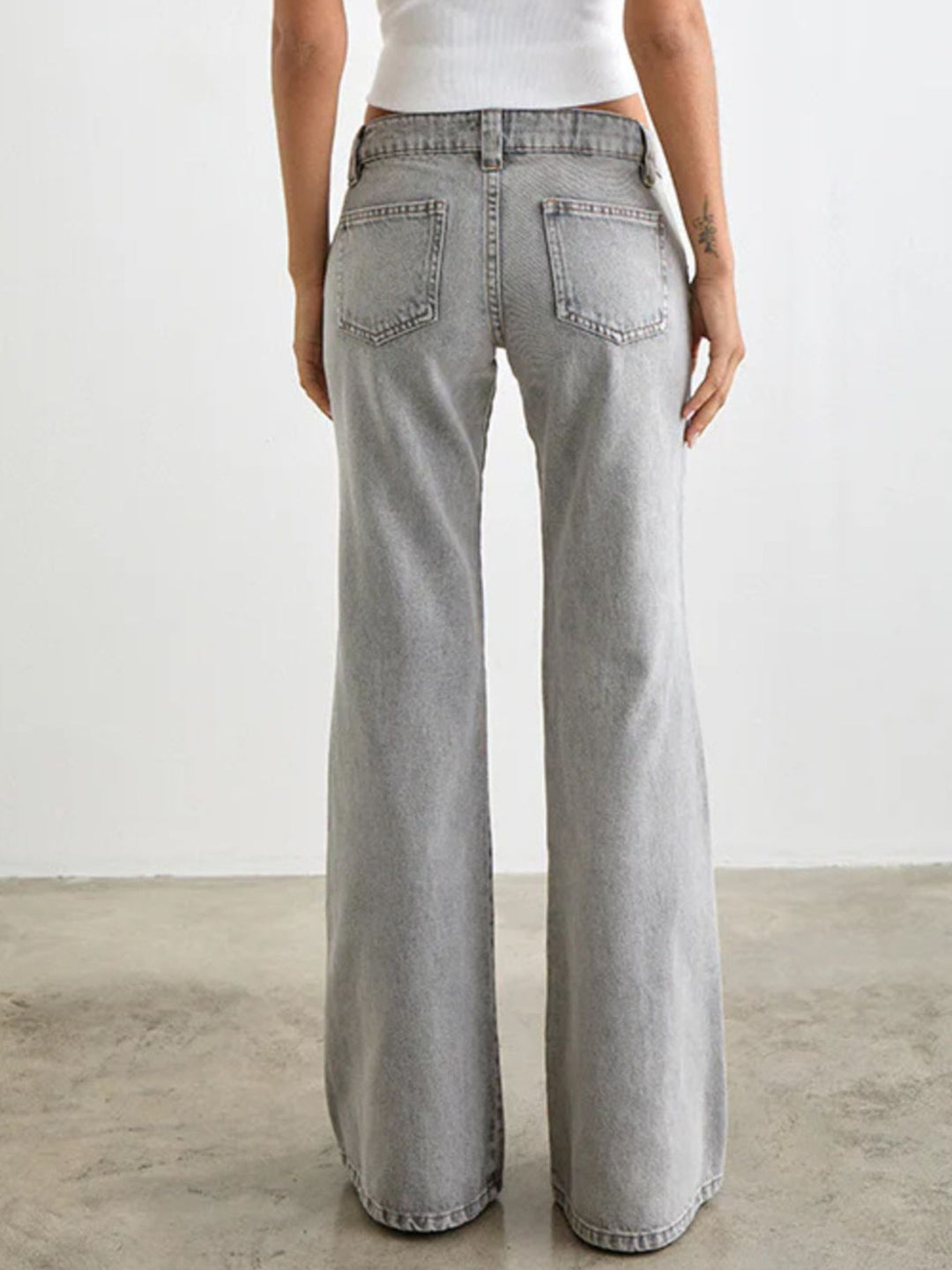 Low-rise washed denim flare leg jeans with 5-pocket styling