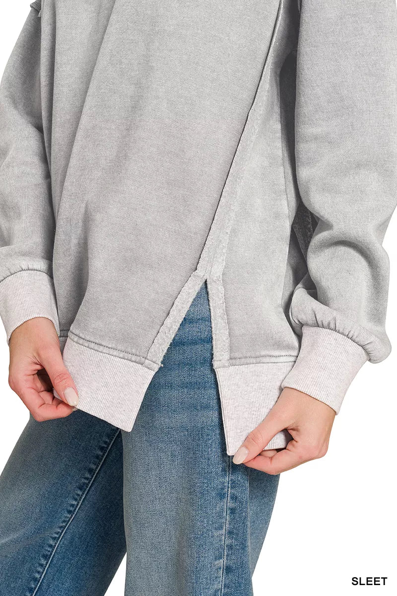 Acid wash fleece pullover with exposed seams and side slits