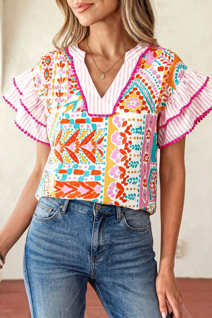 Floral Patchwork mixed print blouse with ruffle sleeves and pom-pom trim