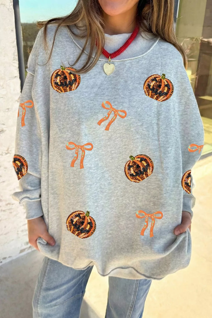 Sequin pumpkin and bow exposed seam Halloween sweatshirt