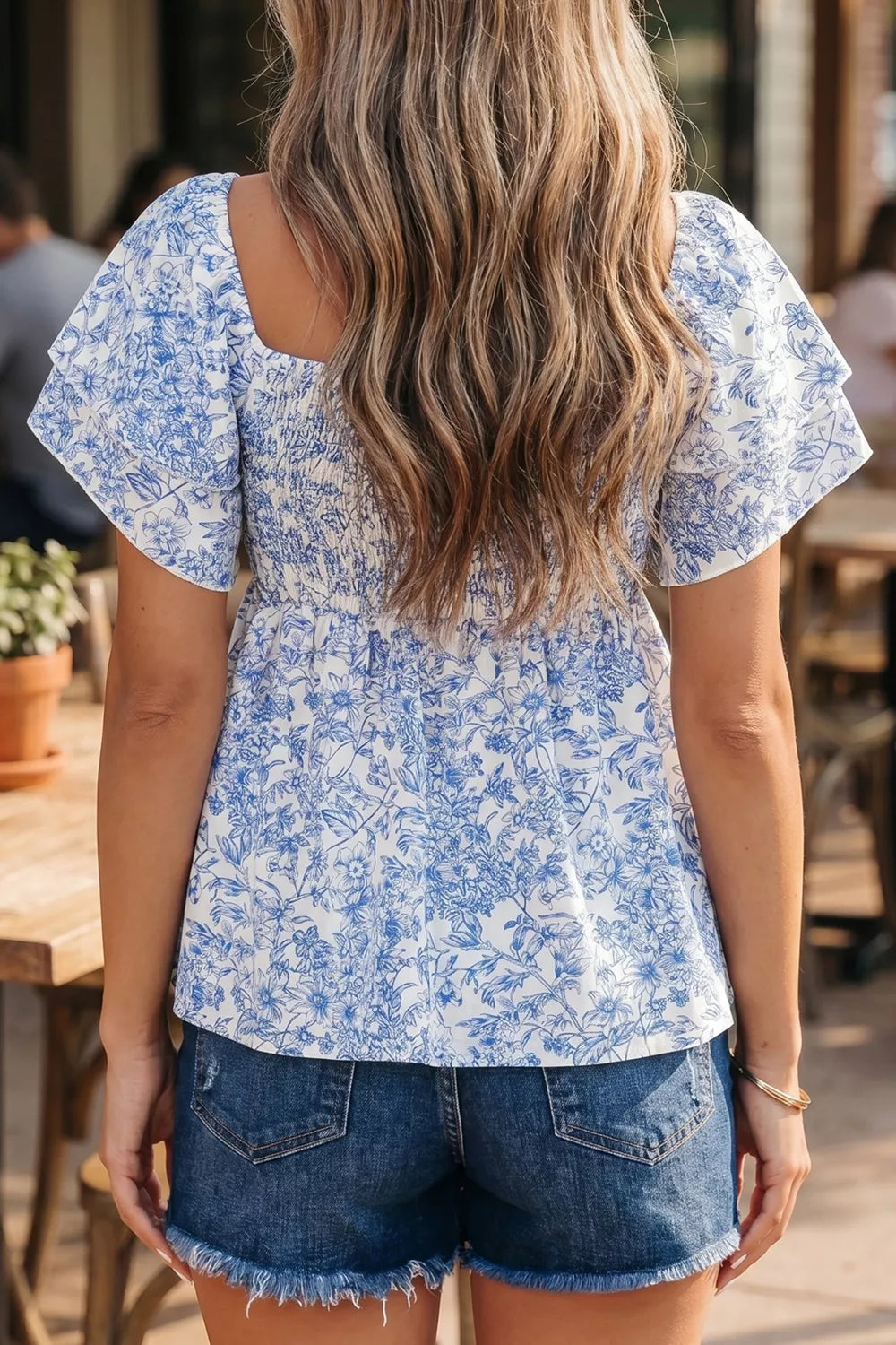 Floral square neck smocked babydoll blouse with ruffle sleeves
