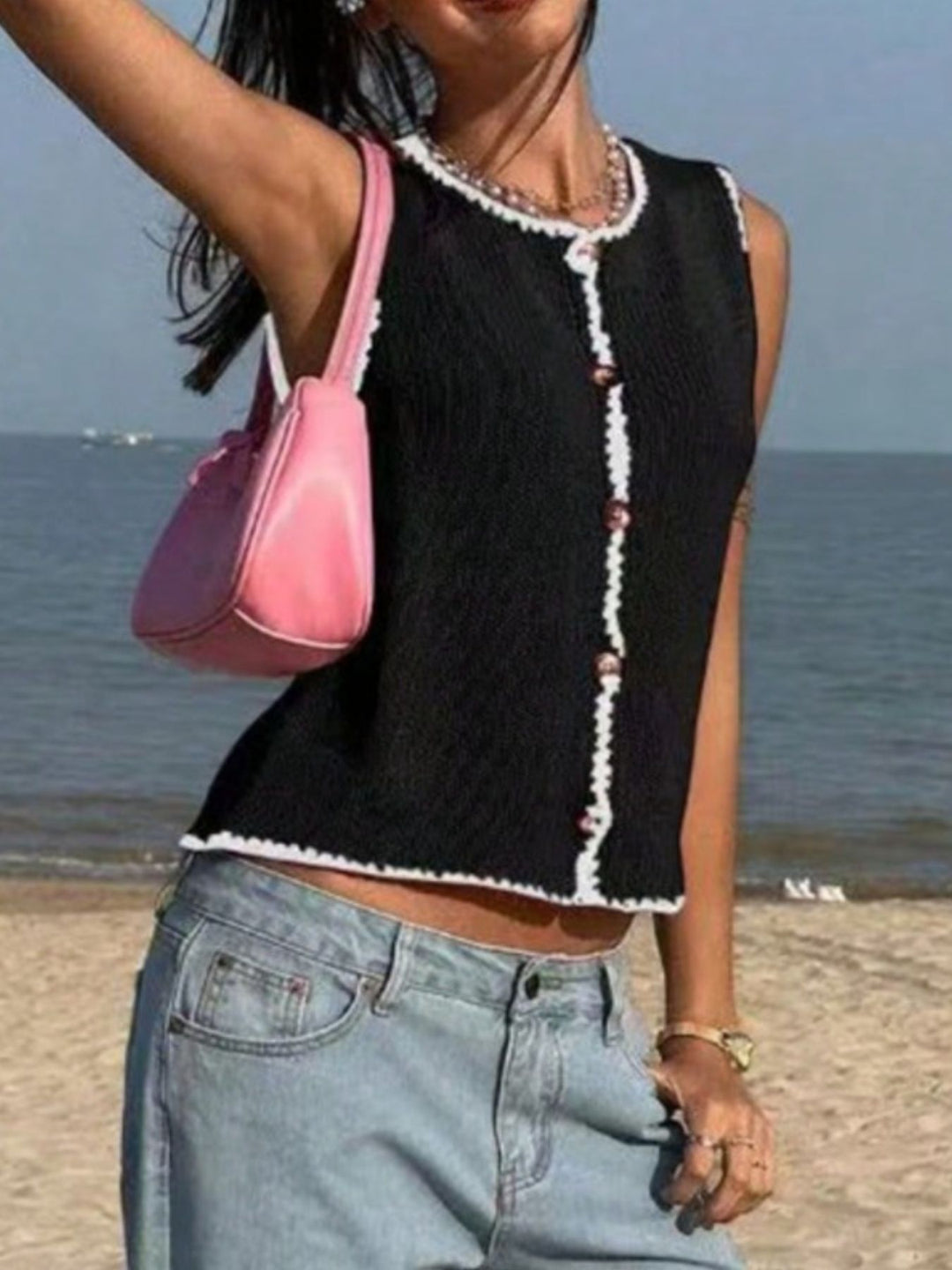 Button-front knit sweater vest with contrast whipstitch trim