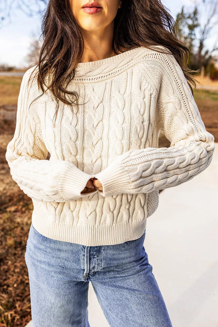Cable knit drop shoulder sweater with ribbed cuffs