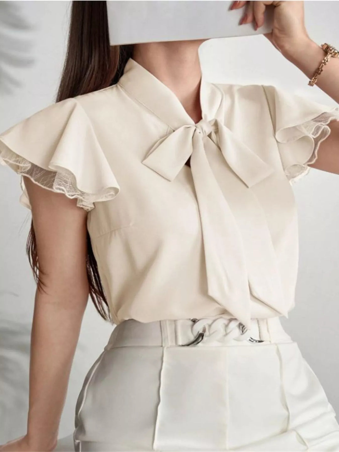 Tie-neck ruffle cap sleeve blouse with lace trim