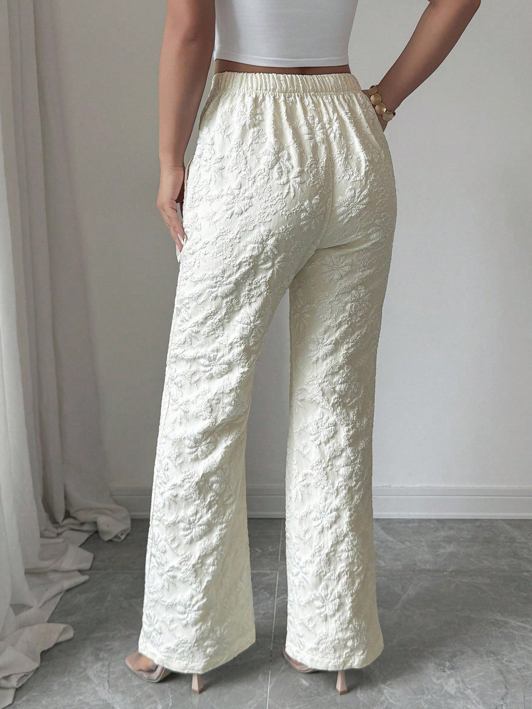 Textured floral high-rise wide-leg pants with pockets