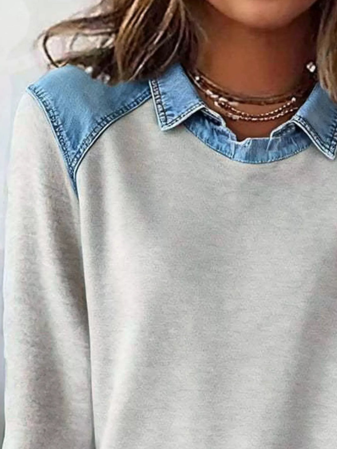 Denim-trim long sleeve crew neck pullover top