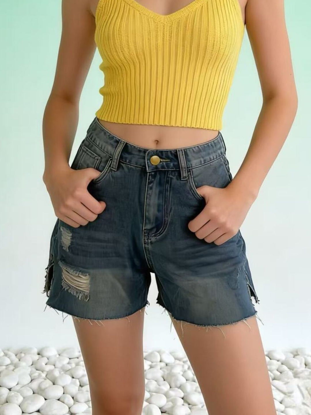 Distressed high-rise denim shorts with frayed raw hem