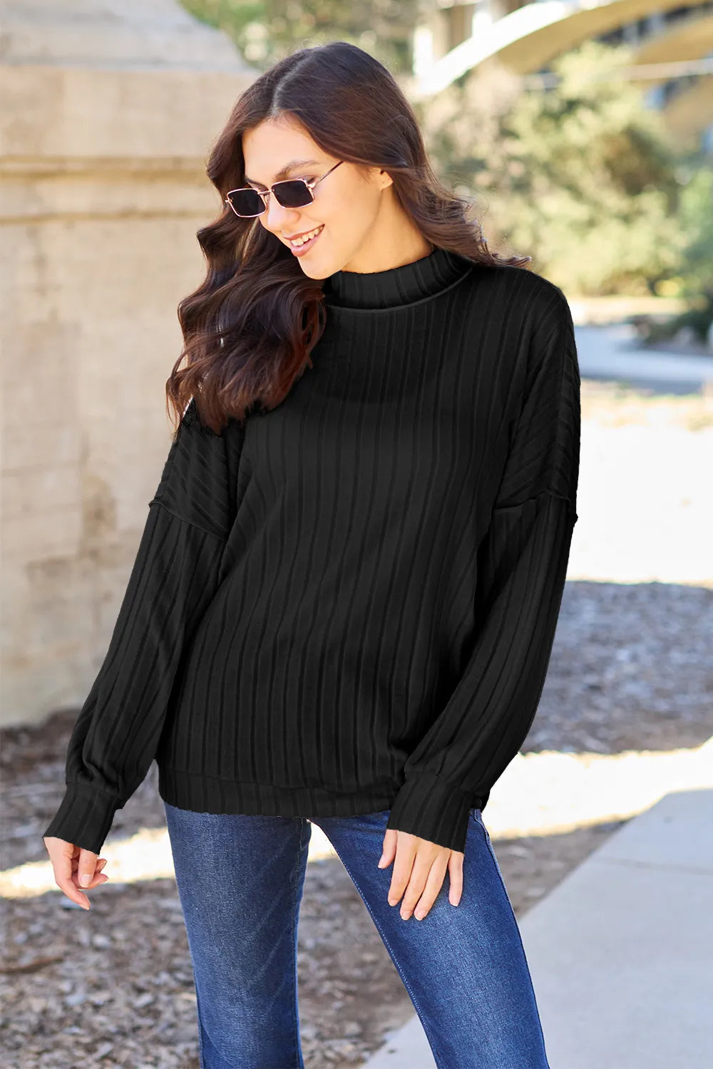 Ribbed exposed-seam mock neck knit top with drop shoulders