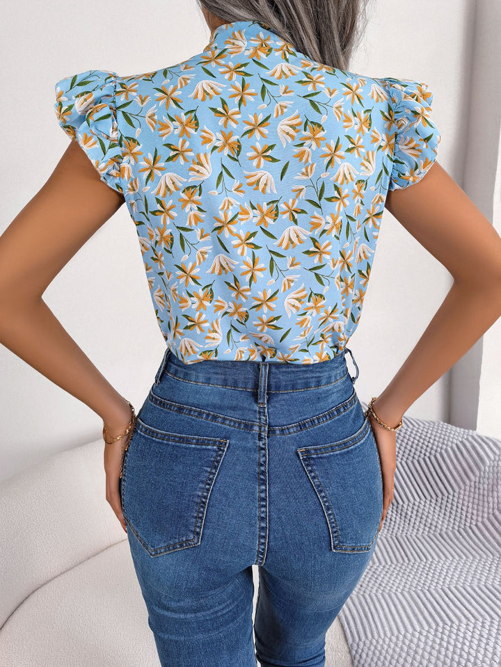 Floral tie-neck blouse with ruffled flutter sleeves