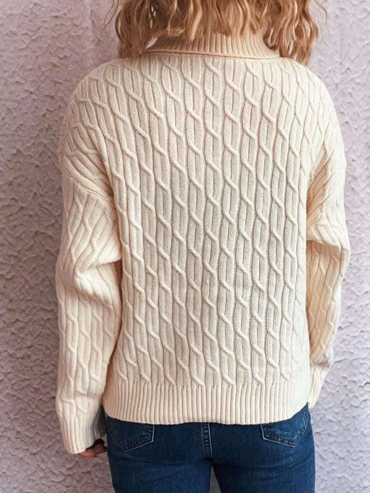 Pumpkin applique cable knit turtleneck sweater