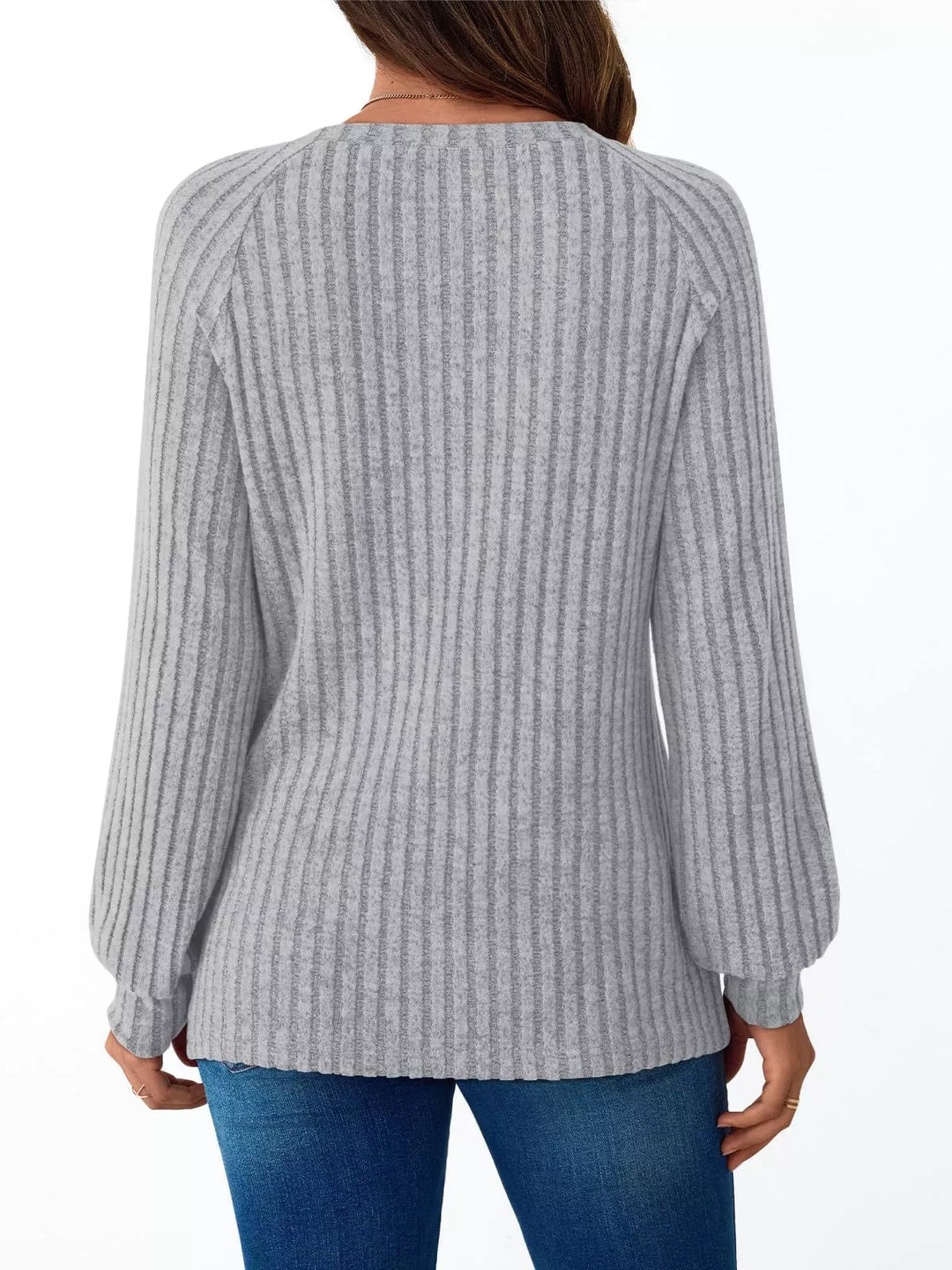 Ribbed knit long sleeve top with decorative shoulder buttons