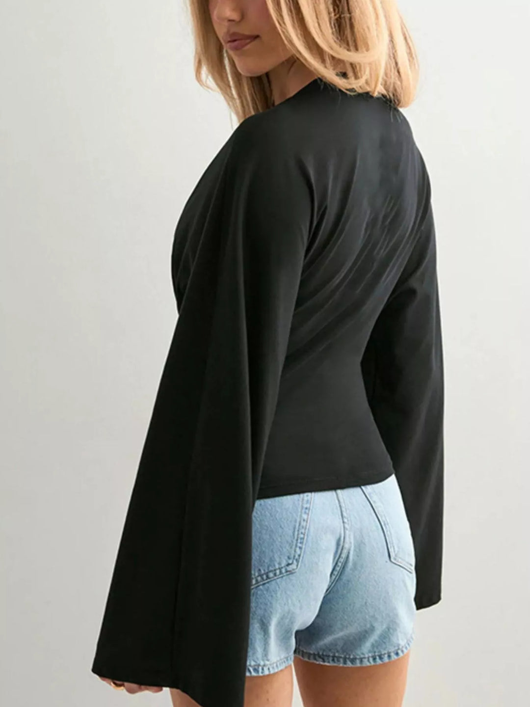 Fitted long sleeve top with flared bell sleeves