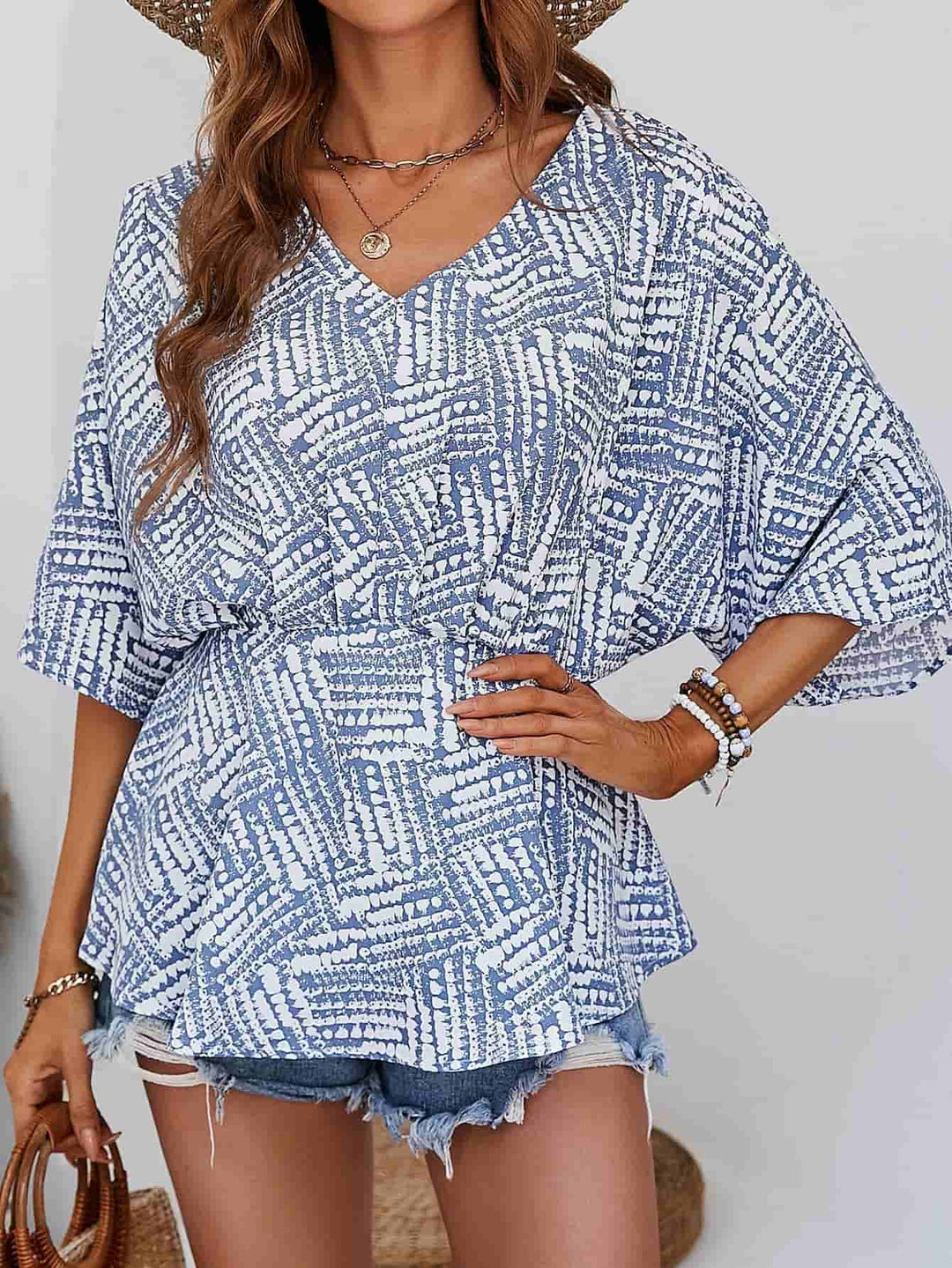 Abstract print V-neck dolman sleeve blouse